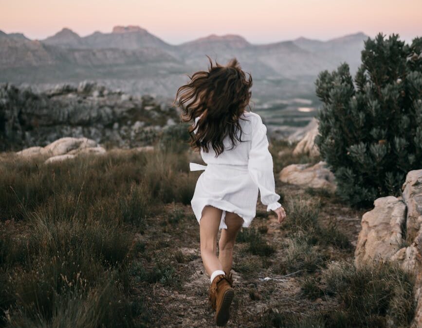 person in white dress running