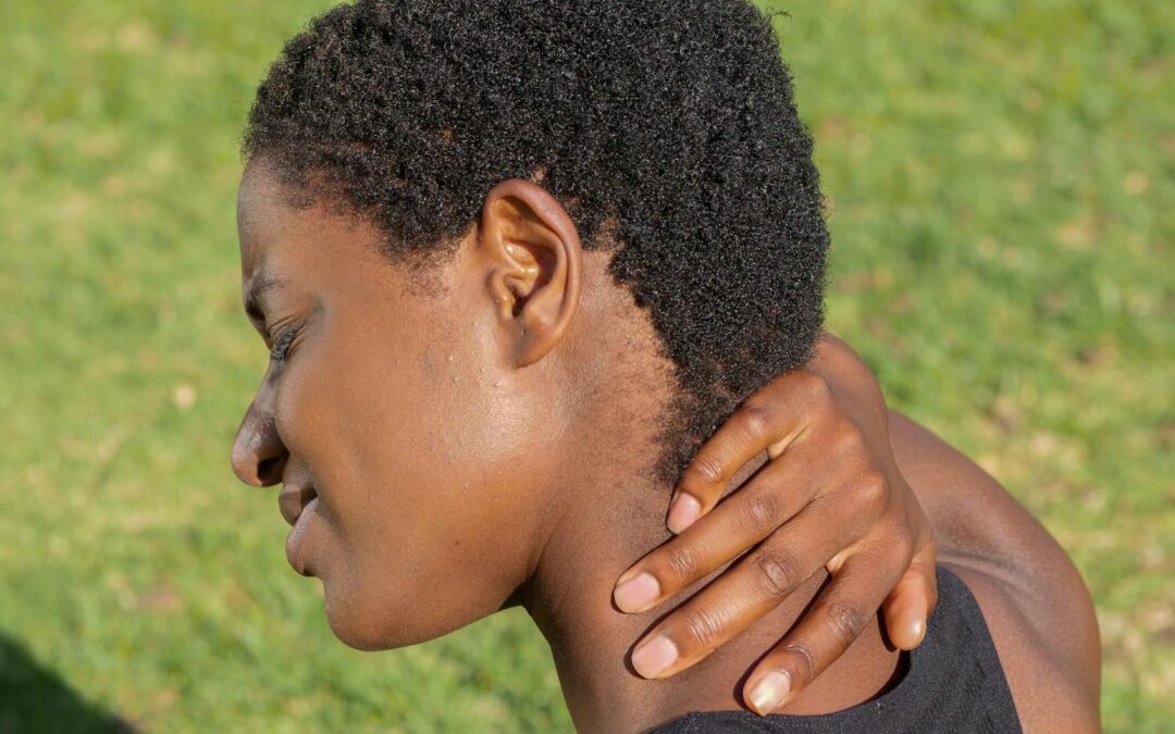 a woman having a neck pain