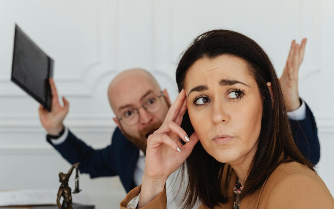 shouting man behind sad woman