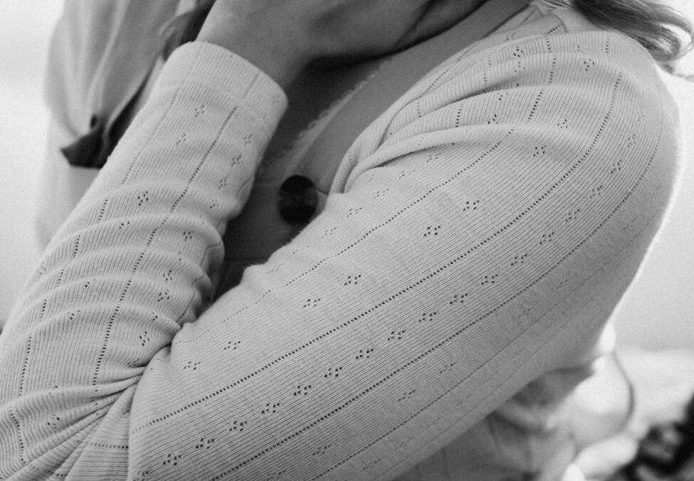 black and white portrait of woman in pensive pose