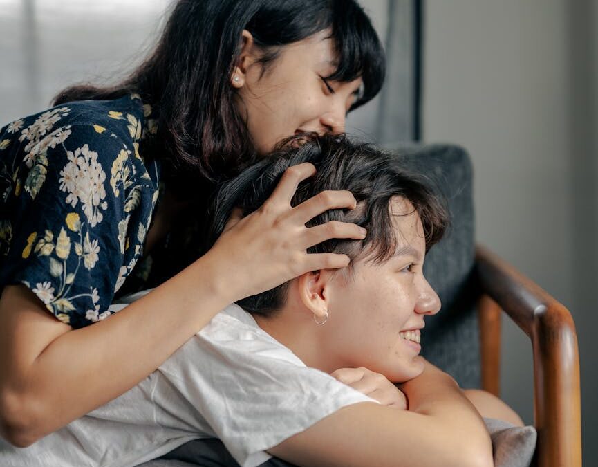 a woman massaging a man s head